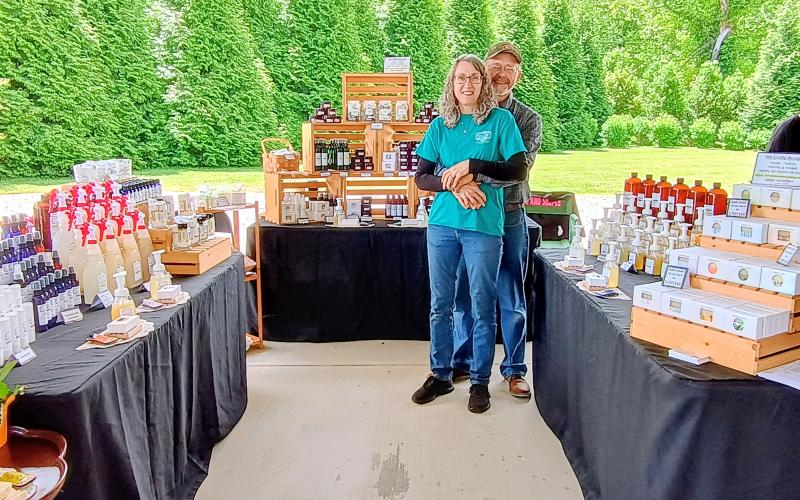 Megan Horn/The Clayton Tribune. Lisa and Scott Filkins with their business “Pure &amp; Simple” showcase their naturally good handmade soap and skin care at this Spring’s Of These Mountains MarketPlace.