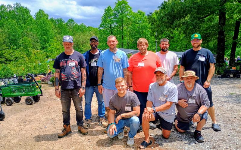 Megan Horn/The Clayton Tribune. Victory Home residents Joseph Coalson, Jeff Pless, Michael Flowers, Anthony Powell, Keelan May, Jeff Smith, Johnathon Cowart, Hunter Blackburn and Bruce Burch worked alongside expert gardeners from Headwaters Master Gardeners Association to prepare for the May 6-May 9 Spring Plant Sale at the Victory Home Greenhouse, located at 157 Victory Home Lane in Tallulah Falls.