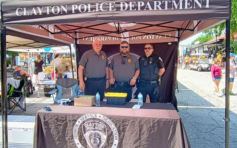 Megan Horn/The Clayton Tribune. Clayton Police Department Chief Mike Turner and officers Andy Beck and Jimmy Nations educate the public and keep the community safe.