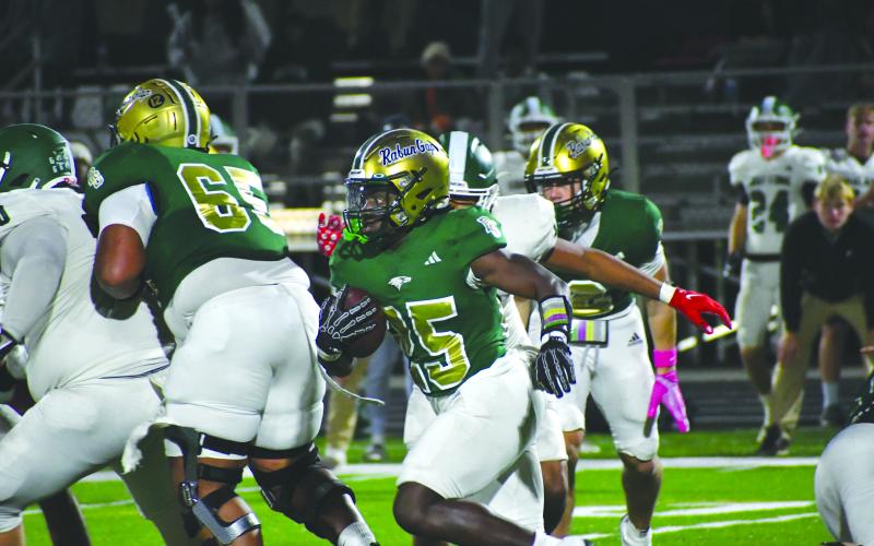 Wesley Branch/The Clayton Tribune. Rabun Gap running back Jordan Lindo searches for a hole during Rabun Gap’s 42-0 regular season victory over Christ School on Oct. 17, 2025. Lindo, who committed to Mercer on June 9, led the Eagles in rushing a season ago.