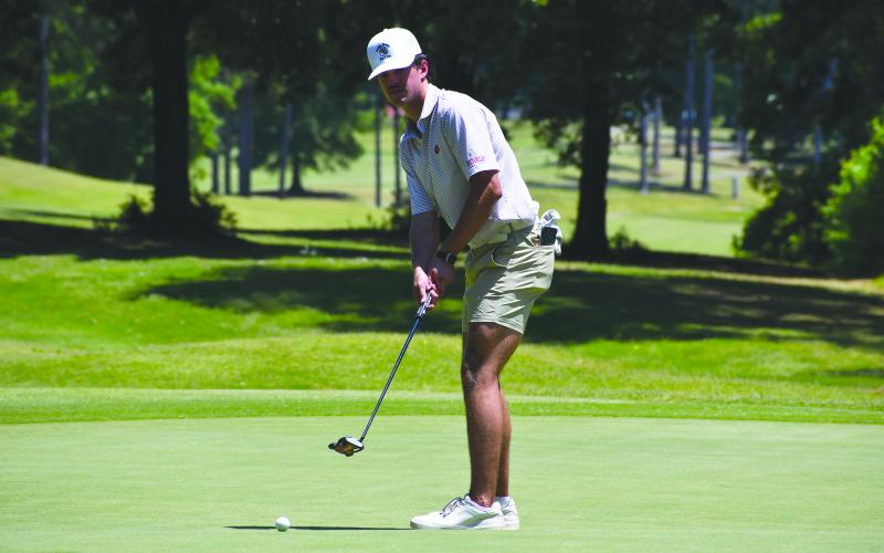 Wesley Branch/The Clayton Tribune. Rabun County senior Ty Truelove watches his putt at the Class A Division I state championship on May 18 at Arrowhead Pointe Golf Course in Elberton. Truelove qualified for the state tournament as an individual for the second consecutive season.