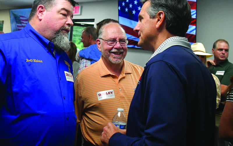 Enoch Autry/The Clayton Tribune. Joey Haban and Stewart Harvard talk with Derek Dooley, a Republican candidate for the U.S. Senate, during a May 29 Meet &amp; Greet as Dooley, a Clayton resident, and Gov. Brian Kemp make a Wildcat Grill visit in Tiger. Dooley will face U.S. Rep. Mike Collins in a June 16 runoff for the nomination.