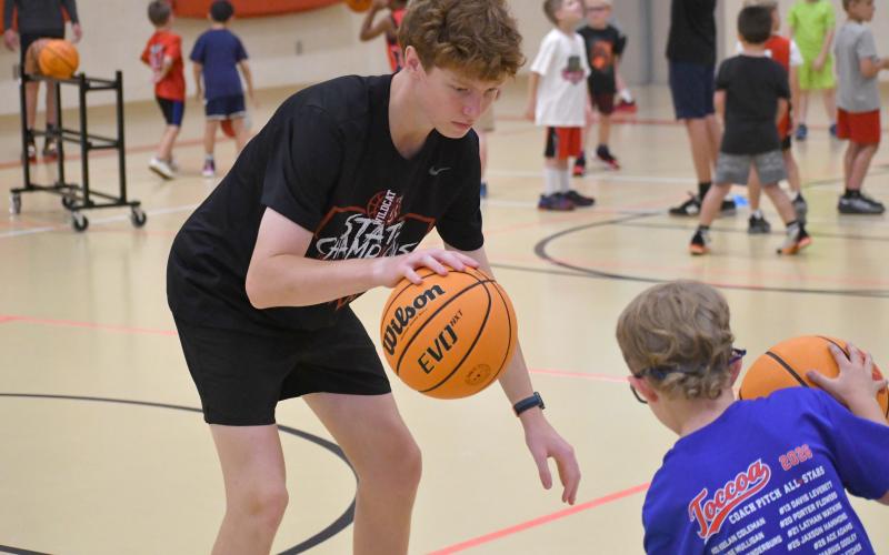 Wesley Branch/The Clayton Tribune. Rabun County sophomore and Wildcat basketball player Graham Anderson helps lead ball-handling drills at the Rabun County basketball camp at the Rabun County Recreation Department on June 2