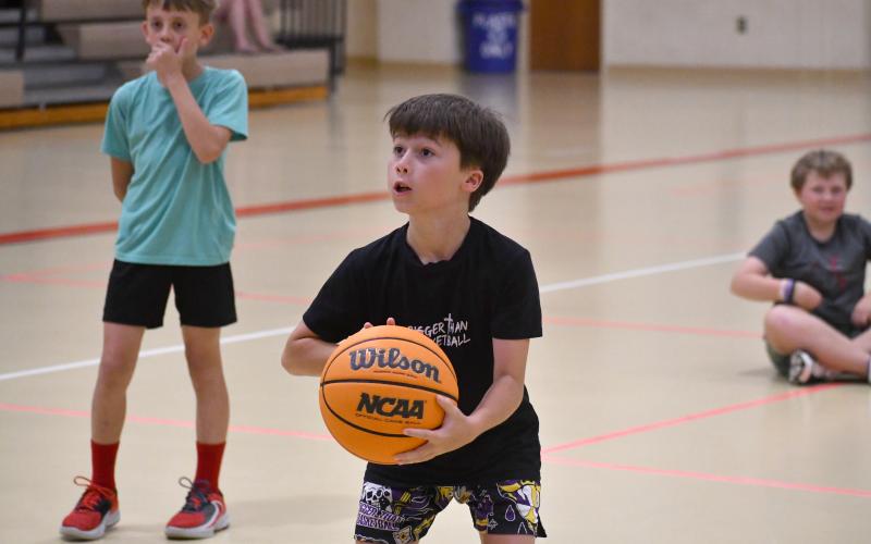 Wesley Branch/The Clayton Tribune.  Basketball camp participants played 3-on-3, competed in a free-throw contest and played other games during the three-day camp session.