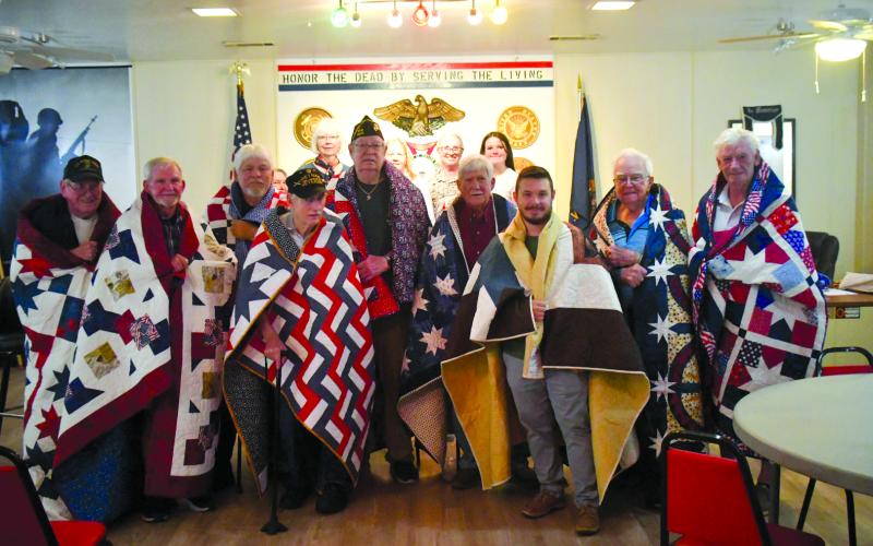 Enoch Autry/The Clayton Tribune. Nine veterans were in attendance at Veterans of Foreign Wars Post 4570 on June 19 to receive Quilts of Valor as each of the quilts took approximately 200 hours to stitch.