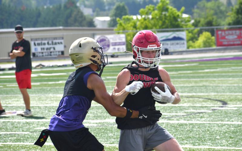 Wesley Branch/The Clayton Tribune. Rabun County rising senior Lawson Beck tries to evade a Union County defender during Rabun County’s 7-on–7 versus Lumpkin County and Union County on June 11 at Union County High School. The Wildcats were victorious versus Lumpkin County, but fell to Union County.