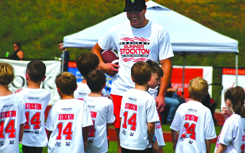 Enoch Autry/The Clayton Tribune. Stockton talks with campers at the June 20 event in Gainesville, Ga.
