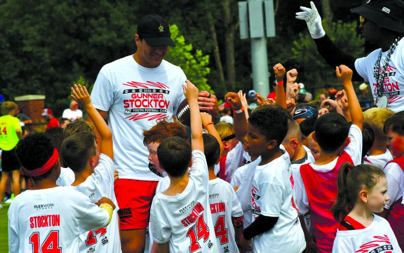 Enoch Autry/The Clayton Tribune. UGA quarterback Gunner Stockton talks with youth at his football camp at Lakeview Academy in Gainesville, Ga., on Saturday, June 20.