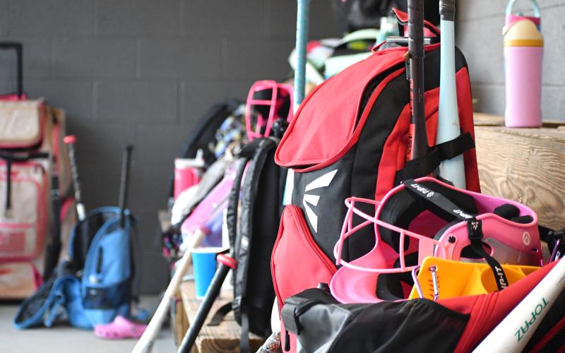 Wesley Branch/The Clayton Tribune. The LadyCats’ dugout was filled with pink bags and gear during the RCHS softball camp on June 15 and 16 at Rabun County High School.