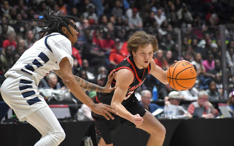 Wesley Branch/The Clayton Tribune. Rabun County point guard Huey Blalock drives to the rim during Rabun County’s 52-43 win over Southwest in the state title game in March. Blalock was inducted into the Blitz Sports boys basketball Hall Fame on Monday.