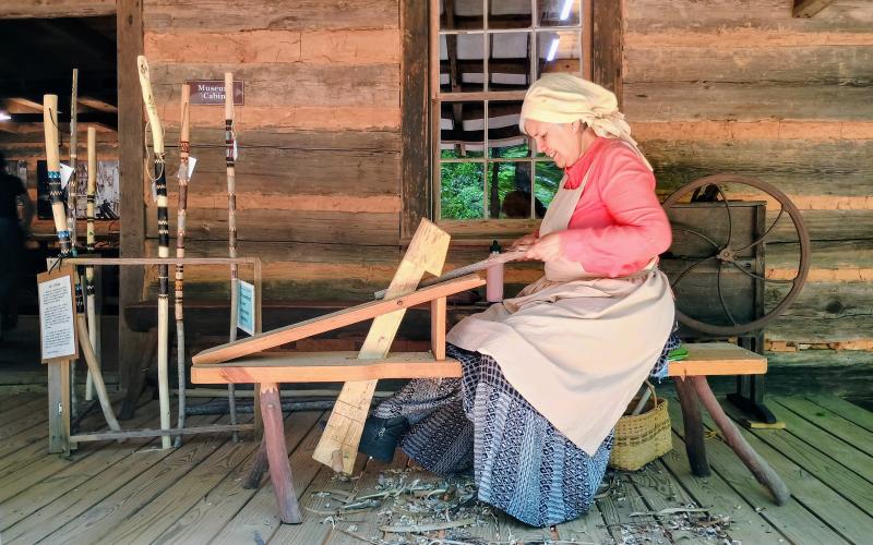 Megan Horn/The Clayton Tribune. Demonstrator Isabel King makes Walking Sticks during Foxfire Heritage Days Friday, June 5, and Saturday, June 6. Over 50 demonstrators were featured at the popular family-friendly event.