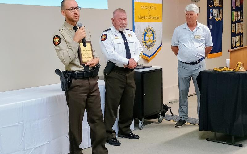 Megan Horn/The Clayton Tribune. Rabun County Sheriff’s Office Deputy Mike Rodriguez thanks the Rotary Club of Clayton as he is awarded the 2026 Police Officer of the Year during their awards ceremony at the Thursday, June 4, lunch meeting. Sheriff Mark Gerrells and Rotary Club of Clayton President Matt Freeman congratulate the deputy.