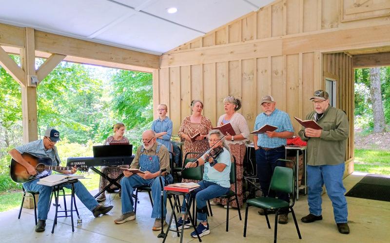 Megan Horn/The Clayton Tribune. The ‘Gospel Family’ group sings about Jesus with an audience enjoying the music at the Reeves Pavillion during Foxfire Heritage Days last weekend. The two-days of family fun were Friday, June 5, and Saturday, June 6.