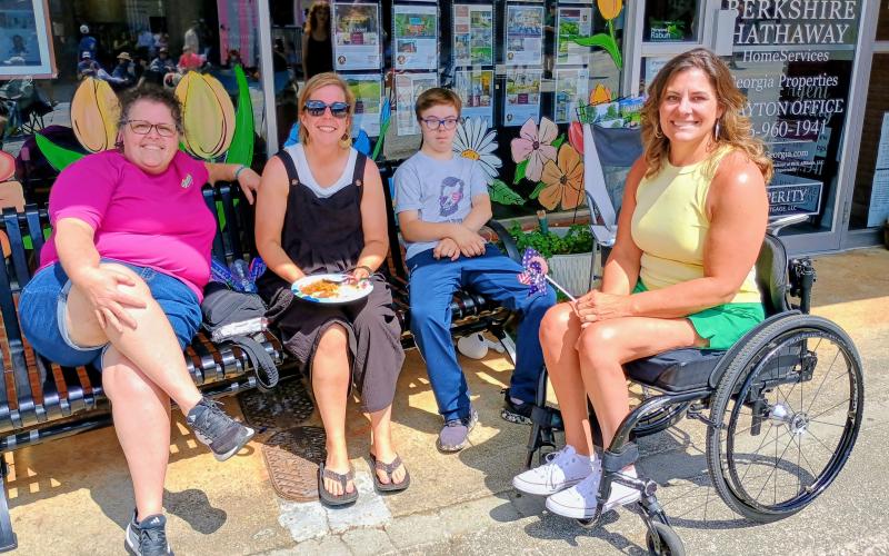 Megan Horn/The Clayton Tribune. Sandra Million, Jennifer Thurmond, Asher Thurmond and Alyson Roth enjoy friendship and have a great time listening to live music at Ramshackle on Saturday, June 6.