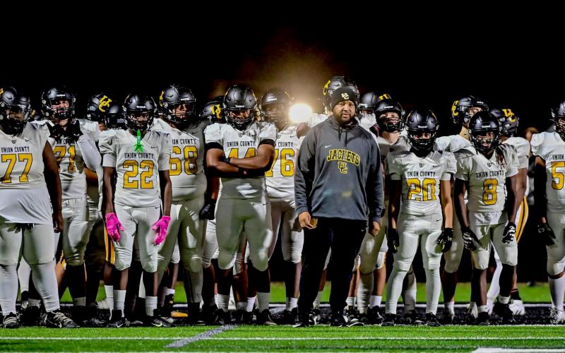 Submitted photo. Quinnon Isom (middle) prepares to lead his team onto the field before kickoff during his head coaching stint at Union County High School in Union, S.C. Isom’s hiring at Rabun Gap brings him closer to home as he is from Toccoa, Ga., and played high school football at Stephens County.