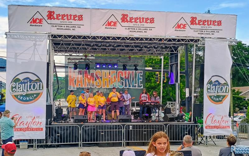 Megan Horn/The Clayton Tribune. Clayton Mayor Roy Quilliams speaks on stage ahead of headliner Grady Spencer &amp; The Vegabonds at Ramshackle on Saturday, June 6.