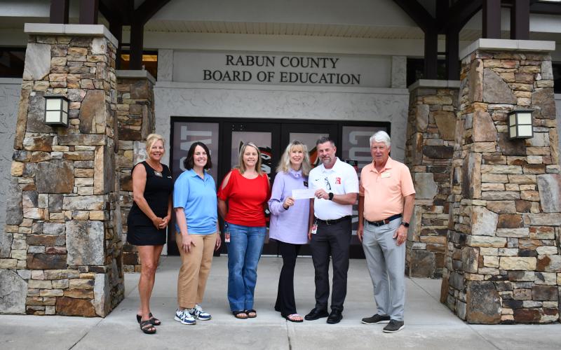 Megan Horn/The Clayton Tribune. Pictured are Rotary Club of Clayton President-Elect Laura Seberg, left; Katie Grady,  executive director of Camp Evergreen; Kelly McKay, assistant superintendent for Rabun County Schools; Karen Bacon, Rotary Club of Clayton Foundation chair; Steven Cole, superintendent of Rabun County Schools; and Matt Freeman, Rotary Club of Clayton President.