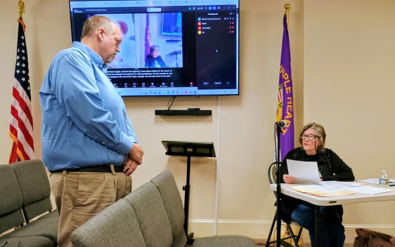 Megan Horn/The Clayton Tribune. Sky Valley citizen Jerri Smith asks City Manager Jason Streetman questions during a May 26 city council Board of Appeals Hearing.