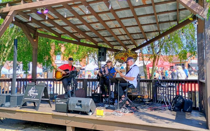 Megan Horn/The Clayton Tribune. Greg Presmanes, Karen Bacon and David Bacon with Sweet Charity’s Playing It Forward perform at Universal Joint during Ramshackle on Saturday, June 6.
