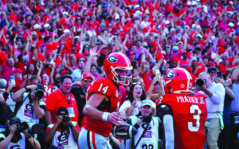 Wesley Branch/The Clayton Tribune. Former Rabun County and current UGA quarterback Gunner Stockton celebrates with teammate Nate Frazier after scoring a rushing touchdown during Georgia’s 43-35 win over Ole Miss at Sanford Stadium on Oct. 18, 2025. Stockton said at SEC Media Days on July 21 that his goal for his final season of college football is to “make memories.” Stockton and the Bulldogs will open the new season on Sept. 5 at home versus Tennessee State.