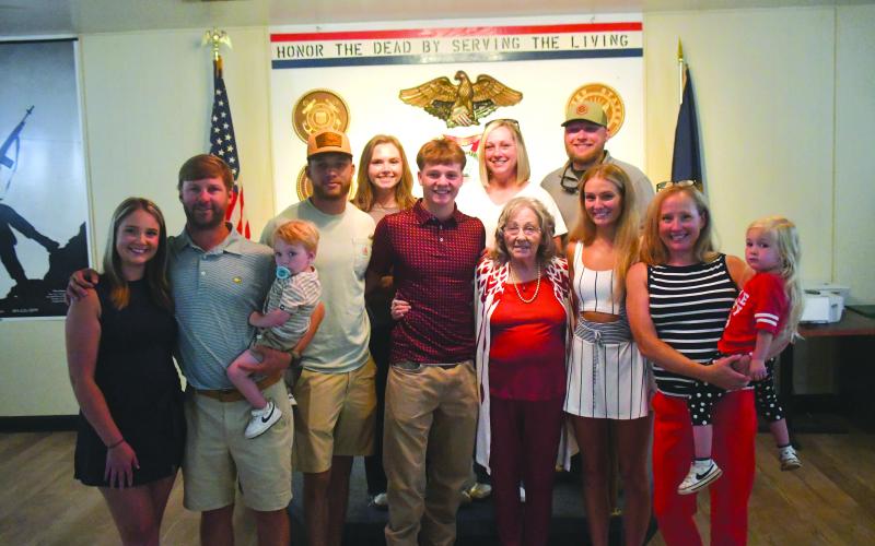 Wesley Branch/The Clayton Tribune. Huey Blalock (center) poses with his family for a photo after being administered his oath of service at VFW Post 4570 in Clayton on June 24. Blalock, who is a midshipman candidate, will head to NAPS, the Naval Academy’s 10-month preparatory school. Blalock was an All-State basketball player for Rabun County.