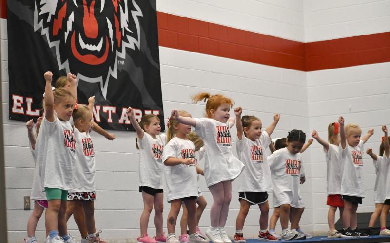 Wesley Branch/The Clayton Tribune. The youngest age group of campers at the Wildcat cheer camp performs their routine during the showcase portion of the camp’s final day. Of the record 88 campers, there were some as young as 3.