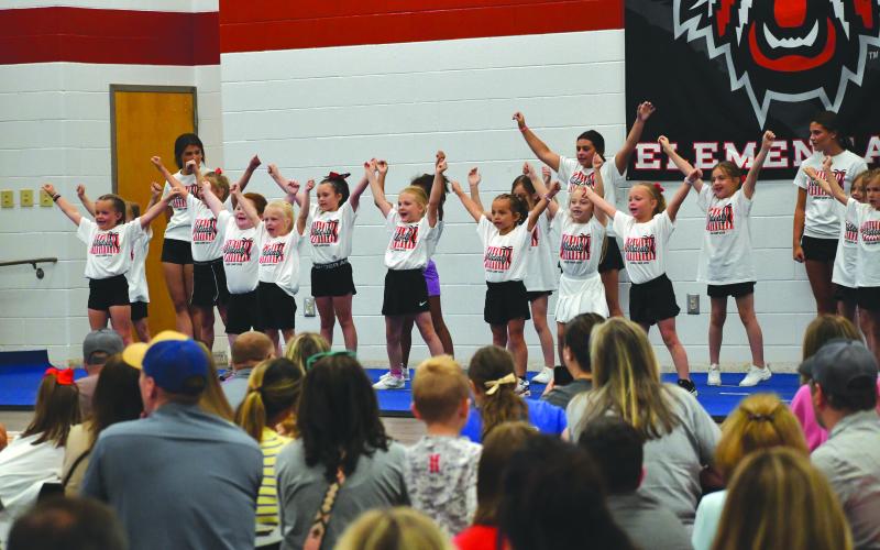 Wesley Branch/The Clayton Tribune. Rabun County campers perform their routine in front of a large crowd inside the Rabun County Elementary School lunchroom on June 25 at the RCHS lil’ Wildcats cheer camp. The Wildcat campers aged 3-13 participated in cheer classes, dance classes, arts &amp; crafts and more during camp.
