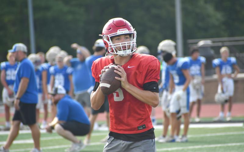 Wesley Branch/The Clayton Tribune. Rising Rabun County sophomore quarterback Cooper Kowalsky looks downfield for an open receiver during the Wildcats’ padded camp session with Trion, Bleckley County and Union County. Kowalsky is slated to be RCHS’ starting quarterback this season.
