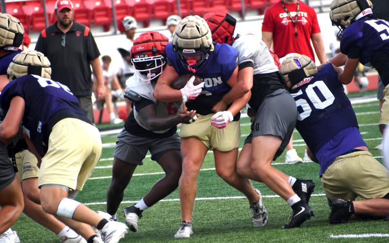 Wesley Branch/The Clayton Tribune. Rabun County rising senior JK Fruster (left) and rising junior Baylor Potts (right) converge on a Union County ball carrier during July 14’s padded camp at Rabun County High School. Both Fruster and Potts will be key contributors at the linebacker position this fall.