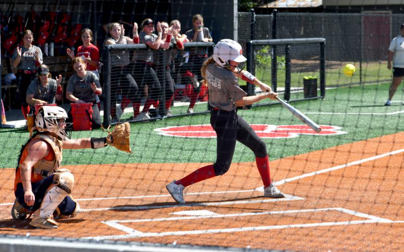 Wesley Branch/The Clayton Tribune. Rabun County’s Kyla Shook makes contact on a pitch during the Lady Cats’ July 20 scrimmage versus Habersham Central at Rabun County High School. The RCHS softball team, led by third-year head coach Jessica Evans, will open the season in just under two weeks at home on Aug. 3 versus Class AAAA opponent East Jackson.