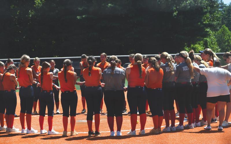Wesley Branch/The Clayton Tribune. Rabun County and Habersham Central players gather to pray together after the teams completed their July 20 scrimmage at Rabun County High School. The Lady Cats are led by third-year head coach Jessica Evans.