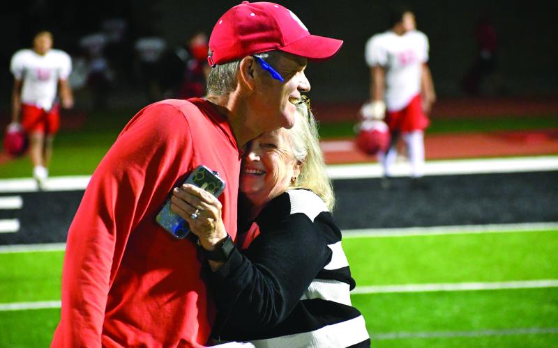 Wesley Branch/The Clayton Tribune. Rabun County head football coach Rance Gillespie (left) hugs his mother Glenda Rogers after Rabun County’s “Midnight Madness” practice. Gillespie is heading into his second year as Rabun County’s head football coach.