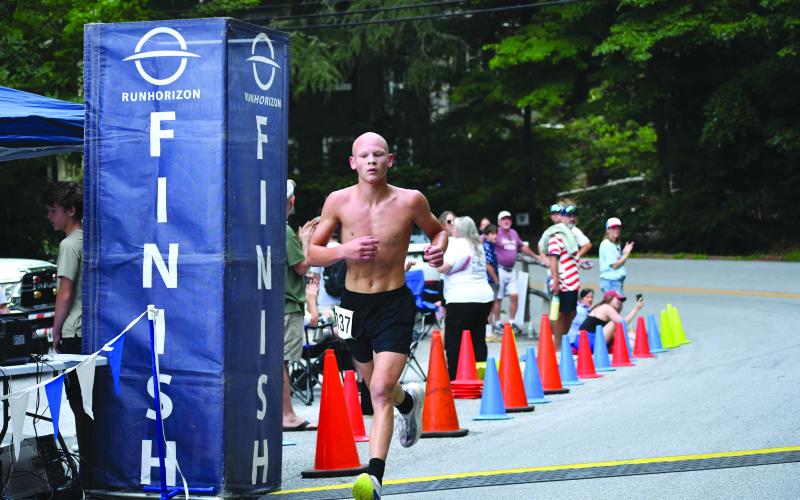 Enoch Autry/The Clayton Tribune. Andrew Wall, 15, wins the Rabun Ramble 5K on Independence Day in Lakemont. Wall is a rising sophomore at Rabun County High School.