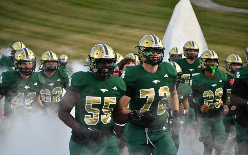 Wesley Branch/The Clayton Tribune. Rabun Gap players run onto the field ahead of kickoff before the Eagles’ game with Christian Brothers College on Oct. 3, 2025. Rabun Gap will face CBC once again this season, as well as four other nationally ranked teams. The Eagles are the preseason No. 115 team in the nation.