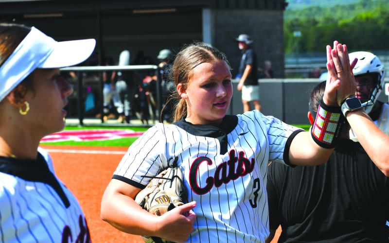 Wesley Branch/The Clayton Tribune. Rabun County’s Jaylynn Gragg receives a high five after completing an inning in the Lady Cats’ 20-3 win over Tallulah Falls on Aug. 16, 2025. Gragg will be one of four potential starting pitchers for RCHS this upcoming season.