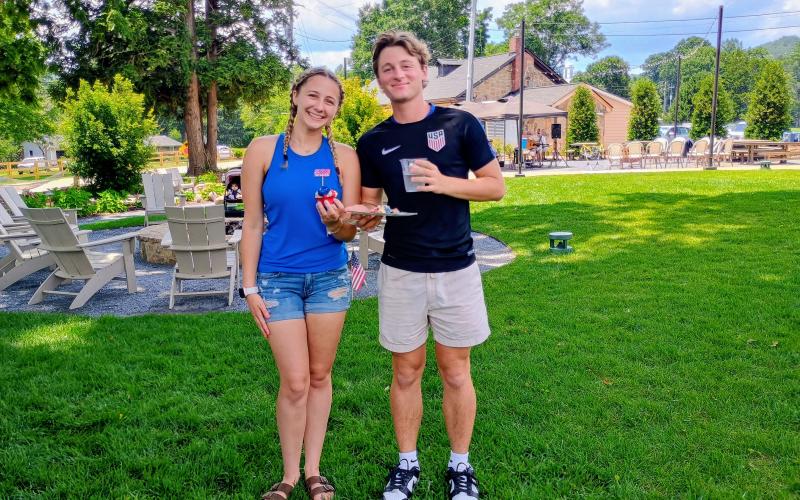 Megan Horn/The Clayton Tribune. Amelia White, left, and Kaleb Fulmer, who are brother and sister, enjoy America’s 250th delicious birthday cake at the Dillard House on July 4. Independence Day traditions continue under new owner Legacy Ventures.
