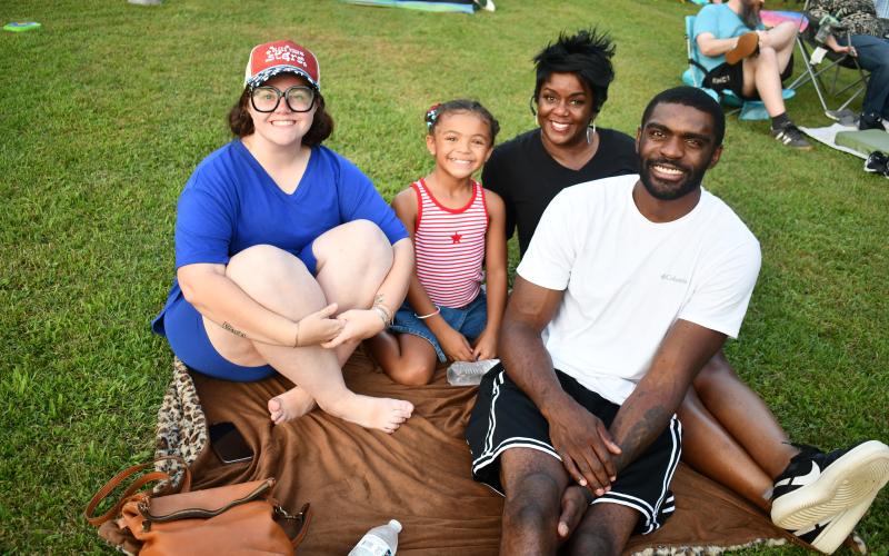 Megan Horn/The Clayton Tribune. Taegan Washington; Kayla Washington; Ericka Evans and Dyangelo Washington from Franklin, N.C., traveled to Clayton for the inaugural Stars Over Clayton Light Show Celebration July 1. They said they feel proud to live in America.