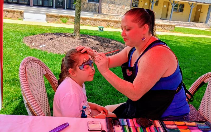 Megan Horn/The Clayton Tribune. Adelyn Chamberlain, 5, has her face painted by Teresa Quintero of the business Pixie &amp; Luna, Face Paint &amp; Balloons, as part of many Independence Day activities at the Dillard House on the OakLawn.