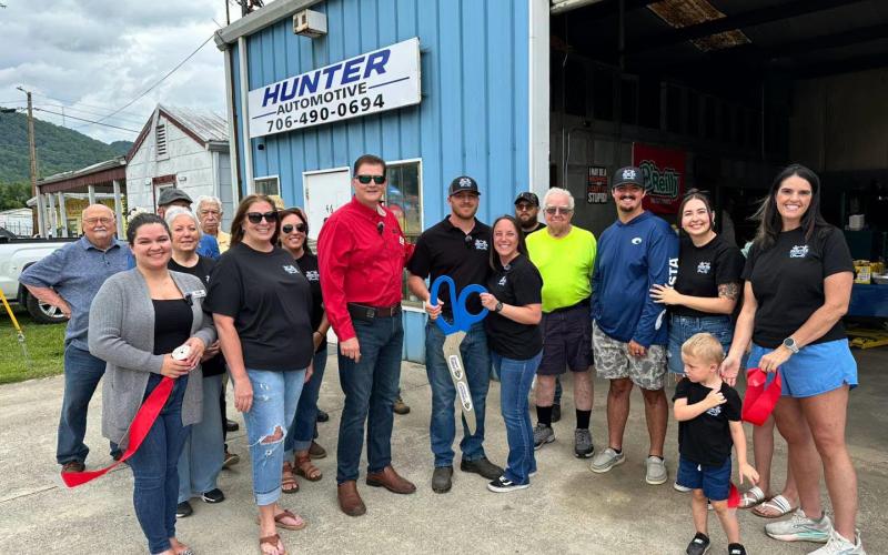 Photo courtesy of Forward Rabun/Rabun County Chamber of Commerce. The ribbon is cut for Hunter Automotive in Clayton for the business’ grand opening on July 10.