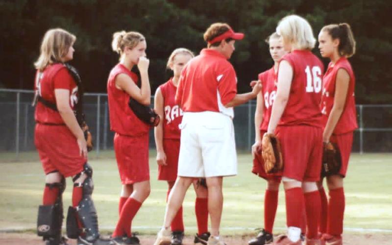 Submitted Photo. Former Rabun County teacher and coach Janice Wayne talks with her team during a softball game. Wayne was the first-ever softball coach at Rabun County High School and left a lasting legacy on Rabun County through her various contributions to athletics and her heart for others.