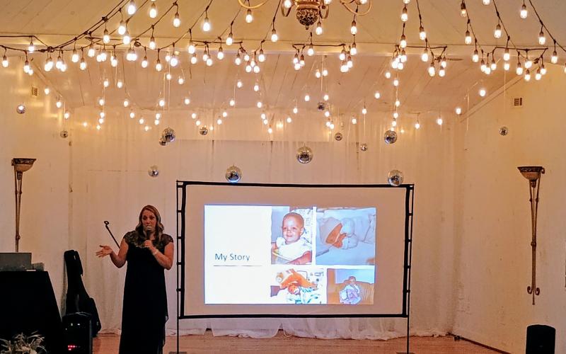 Megan Horn/The Clayton Tribune. Lauren Eden gives the Keynote Address during the Choices Pregnancy Center “Heartbeat Gala” at Chota Falls on Saturday, Aug. 1. Eden’s book is titled “Miracle Baby: The Story I Was Born to Tell.”