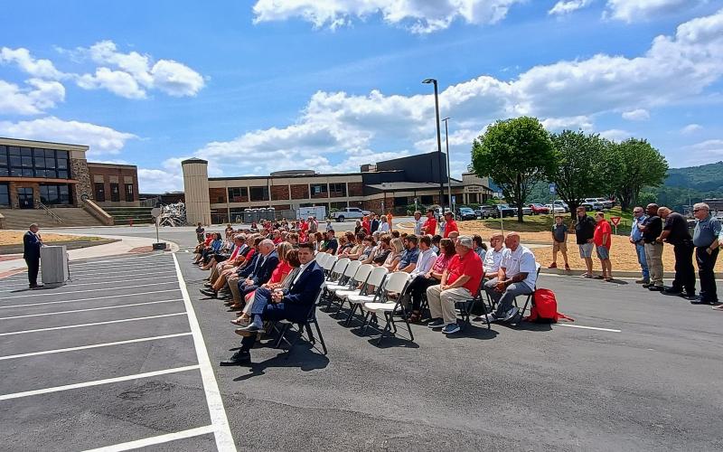 Megan Horn/The Clayton Tribune.  School board members, local leadership, elected officials, community partners, parents, administrators and teachers were at the July 31 ceremony to mark the historic moment for the school district when they cut the ribbon on the new high school academic building.
