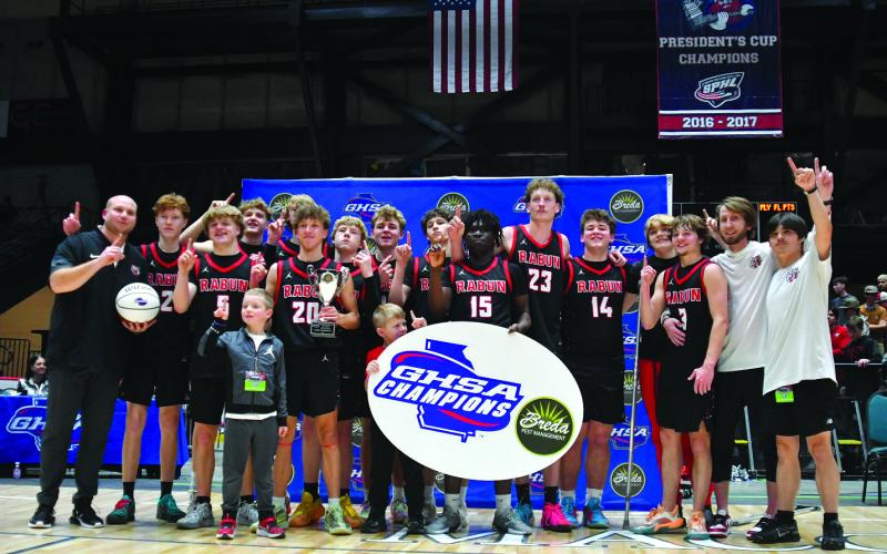 Enoch Autry/The Clayton Tribune. The Rabun County boys basketball team members have beaming smiles as they proudly hold their Class A Division I state championship trophy in the Macon Coliseum on Macon 13 after defeating Southwest-Macon 52-43. The team will receive its title rings on Friday night.