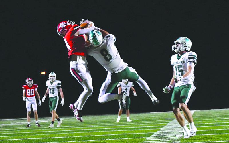 Enoch Autry/The Clayton Tribune. Rabun County wide receiver Colter Cannon, now a junior, hauls in a heavily contested 50-50 catch against region opponent Athens Academy on Friday, Oct. 24, 2025.