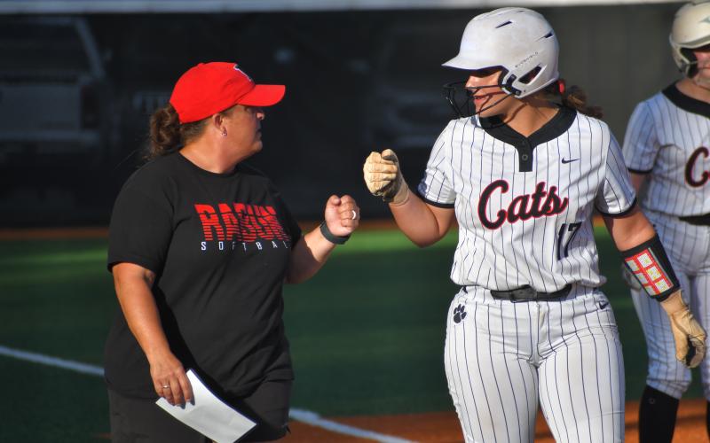 Wesley Branch/The Clayton Tribune. Head coach Jessica Evans (left) and RCHS junior River Evans fist bump during Rabun County’s 15-14 win versus East Jackson on Aug. 3, 2026.