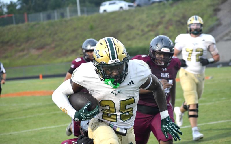 Wesley Branch/The Clayton Tribune. Rabun Gap running back Jordan Lindo fights off a Westside defender during Rabun Gap’s Aug. 14 scrimmage versus Westside (S.C.) at Chapman High School. Lindo, a Mercer commit, scored one of two touchdowns for the Eagles in the game.