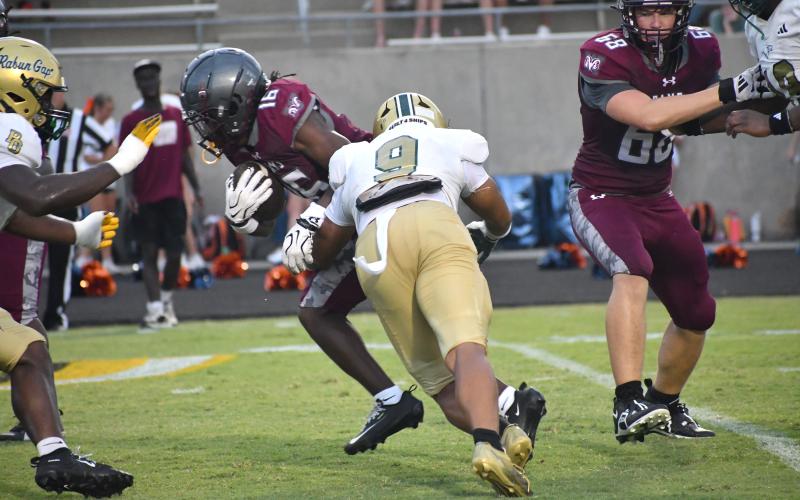 Wesley Branch/The Clayton Tribune. Rabun Gap linebacker Kaylan Brown tackles a Westside ball-carrier during the Eagles and Rams’ Aug. 14 scrimmage at Chapman High School. Brown, an East Tennessee State commit, is poised for a larger role this season in Rabun Gap’s defense.