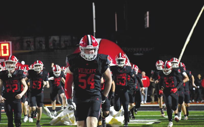 Wesley Branch/The Clayton Tribune. Rabun County’s Ryan Yearwood (center) runs onto the field ahead of the Wildcats’ playoff win over Dodge County Nov. 14, 2025. Yearwood, a senior this year, will be one of the Wildcats’ starting defensive tackles.