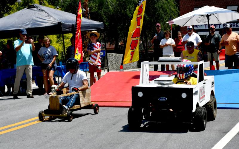 Enoch Autry/The Clayton Tribune.  The public works truck took third place in the Adult Division with Tim Overholt of the soapbox derby, but also captured the Outlaw Class as Cayden English from the youth division was the driver.