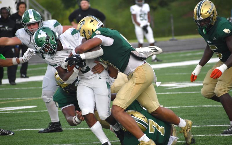 Wesley Branch/The Clayton Tribune. Rabun Gap defenders fight to bring down Venice’s Dorien Jones during the Eagles’ 42-40 overtime loss on Aug. 21 to Venice. RGNS will travel to Brownsburg, Ind., to face No. 17 Brownsburg on Friday, Aug. 28.
